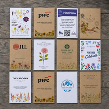Load image into Gallery viewer, Custom printed seed packets for business, showing examples of branded packets in white and kraft
